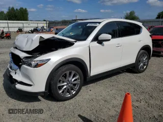 2020 Mazda CX-5 Grand Touring with VIN JM3KFBDM4L1858237, listed as a Copart auction lot 60883985 with 82,140 mi miles and Salvage title. Bid and sale history available at DreamBid. Image 1.