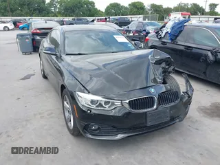 2015 BMW 4 Series 428i xDrive with VIN WBA3N9C50FK247734, listed as a IAAI auction lot 42050172 with 82,475 mi miles and . Bid and sale history available at DreamBid. Image 1.