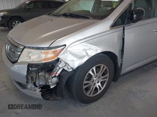 2012 Honda Odyssey EX-L with VIN 5FNRL5H67CB005013, listed as a IAAI auction lot 42295586 with 200,611 mi miles and . Bid and sale history available at DreamBid. Image 6.
