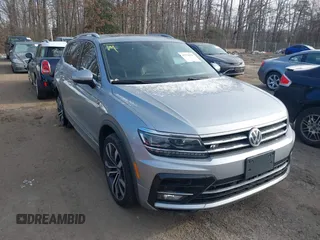 2019 Volkswagen Tiguan SEL Premium with VIN 3VV4B7AX3KM175019, listed as a IAAI auction lot 41374333 with 95,722 mi miles and . Bid and sale history available at DreamBid. Image 1.