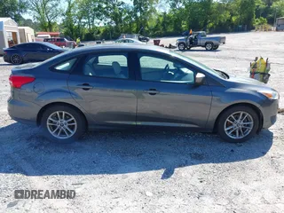 2018 Ford Focus SE z VIN 1FADP3FE1JL238012, wystawiony jako IAAI lot #42185232 z przebiegiem 143 687 mil mil oraz . Historia ofert i sprzedaży dostępna na DreamBid. Obrazek 13.
