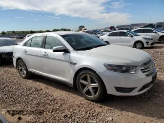 2015 Ford Taurus SEL with VIN 1FAHP2E92FG172960, listed as a Copart auction lot 84866524 with 115,115 mi miles and Salvage Title. Bid and sale history available at DreamBid. Image 4.
