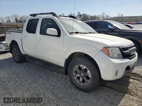 2015 Nissan Frontier Pro-4X with VIN 1N6AD0EV5FN700571, listed as a Copart auction lot 50974615 with 138,930 mi miles and Salvage title. Bid and sale history available at DreamBid. Image 4.