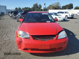 2003 Honda Civic LX with VIN 1HGEM21513L052399, listed as a Copart auction lot 77002124 with 158,029 mi miles and Salvage Title. Bid and sale history available at DreamBid. Image 5.