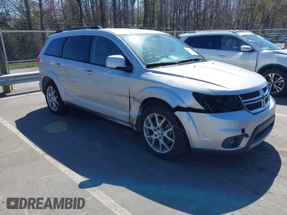 2014 Dodge Journey SXT z VIN 3C4PDCBG7ET227470, wystawiony jako IAAI lot #41843128 z przebiegiem 98 195 mil mil oraz . Historia ofert i sprzedaży dostępna na DreamBid. Obrazek 1.