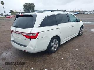 2013 Honda Odyssey Touring with VIN 5FNRL5H99DB041328, listed as a IAAI auction lot 41797520 with 148,523 mi miles and . Bid and sale history available at carsss.com. Image 4.
