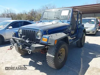 2000 Jeep Wrangler Sport with VIN 1J4FA49S0YP770943, listed as a IAAI auction lot 41817600 with 165,379 mi miles. Bid and sale history available at carsss.com. Image 2.
