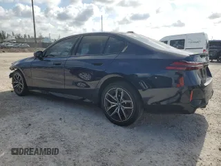 2024 BMW i5 eDrive40 with VIN WBY33FK09RCR50159, listed as a Copart auction lot 55520615 with 12,564 mi miles and Salvage title. Bid and sale history available at DreamBid. Image 2.