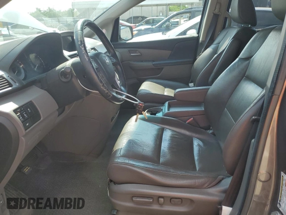 2011 Honda Odyssey EX-L with VIN 5FNRL5H61BB056652, listed as a Copart auction lot 54774015 with 233,125 mi miles and Salvage Title. Bid and sale history available at DreamBid. Image 7.