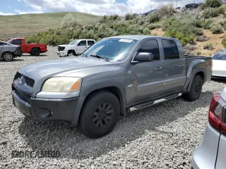 2006 Mitsubishi Raider Duro Cross z VIN 1Z7HC38N86S542959, wystawiony jako Copart lot #57301385 z przebiegiem 149 167 mil mil oraz Tytuł czysty. Historia ofert i sprzedaży dostępna na DreamBid. Obrazek 1.
