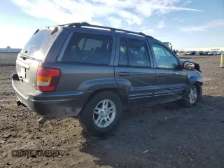 2003 Jeep Grand Cherokee Limited z VIN 1J8GW58N73C502929, wystawiony jako Copart lot #79472734 z przebiegiem 231 176 mil mil oraz Szkoda całkowita • Salvage title. Historia ofert i sprzedaży dostępna na DreamBid. Obrazek 3.