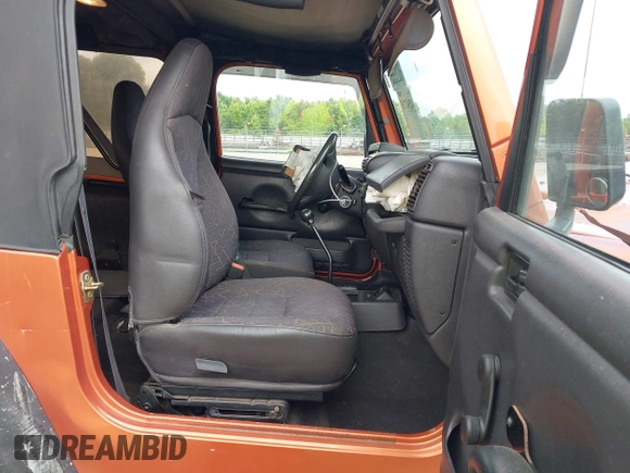 2001 Jeep Wrangler Sport z VIN 1J4FA49S01P341940, wystawiony jako IAAI lot #42542715 z przebiegiem 87 651 mil mil oraz . Historia ofert i sprzedaży dostępna na DreamBid. Obrazek 5.