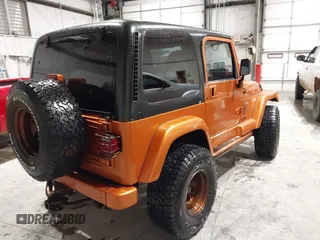 1998 Jeep Wrangler Sahara z VIN 1J4FY49S1WP802940, wystawiony jako IAAI lot #41433820 z przebiegiem 122 180 mil mil oraz . Historia ofert i sprzedaży dostępna na DreamBid. Obrazek 4.