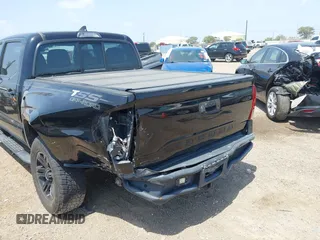 2018 Toyota Tacoma SR with VIN 5TFAX5GN5JX126118, listed as a IAAI auction lot 41949791 with 37,615 mi miles and . Bid and sale history available at DreamBid. Image 6.