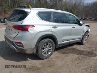 2019 Hyundai Santa Fe SE z VIN 5NMS2CAD5KH115511, wystawiony jako IAAI lot #42017668 z przebiegiem 91 584 mil mil oraz . Historia ofert i sprzedaży dostępna na DreamBid. Obrazek 4.
