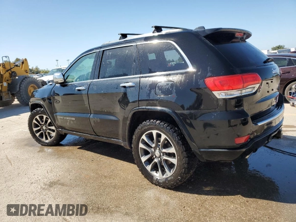 2017 Jeep Grand Cherokee Overland with VIN 1C4RJFCTXHC778491, listed as a Copart auction lot 73944594 with 99,235 mi miles and Clean Title. Bid and sale history available at carsss.com. Image 2.