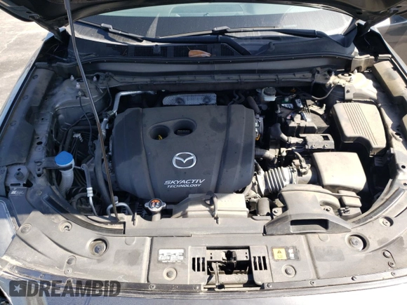 2019 Mazda CX-5 Grand Touring with VIN JM3KFADM6K1641992, listed as a Copart auction lot 57862345 with 37,100 mi miles and Salvage title. Bid and sale history available at DreamBid. Image 12.