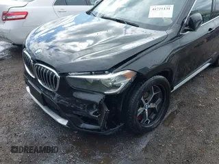 2018 BMW X1 xDrive28i z VIN WBXHT3C35J5L34646, wystawiony jako IAAI lot #41725131 z przebiegiem 81 983 mil mil oraz . Historia ofert i sprzedaży dostępna na DreamBid. Obrazek 6.