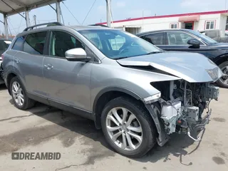 2011 Mazda CX-9 Grand Touring z VIN JM3TB2DA5B0319538, wystawiony jako IAAI lot #42429157 z przebiegiem 88 321 mil mil oraz . Historia ofert i sprzedaży dostępna na DreamBid. Obrazek 1.