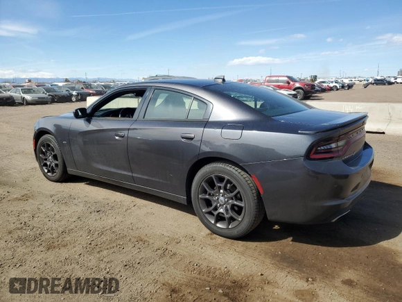 2018 Dodge Charger GT with VIN 2C3CDXJG2JH198605, listed as a Copart auction lot 49084635 with 128,646 mi miles and Salvage Title. Bid and sale history available at DreamBid. Image 2.