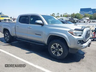 2018 Toyota Tacoma SR5 with VIN 3TMBZ5DN5JM013763, listed as a IAAI auction lot 42624769 with 90,672 mi miles and . Bid and sale history available at DreamBid. Image 1.