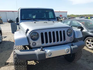 2015 Jeep Wrangler Unlimited Sahara with VIN 1C4BJWEG2FL558860, listed as a IAAI auction lot 41937360 with 113,627 mi miles. Bid and sale history available at carsss.com. Image 13.