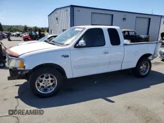 2002 Ford F-150 XL with VIN 1FTRX17212NA28461, listed as a Copart auction lot 63710665 with 185,460 mi miles and Salvage title. Bid and sale history available at DreamBid. Image 1.