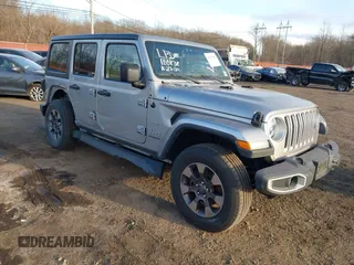 2018 Jeep Wrangler Unlimited Sahara z VIN 1C4HJXEN4JW173435, wystawiony jako IAAI lot #41453040 z przebiegiem 51 530 mil mil oraz . Historia ofert i sprzedaży dostępna na DreamBid. Obrazek 1.