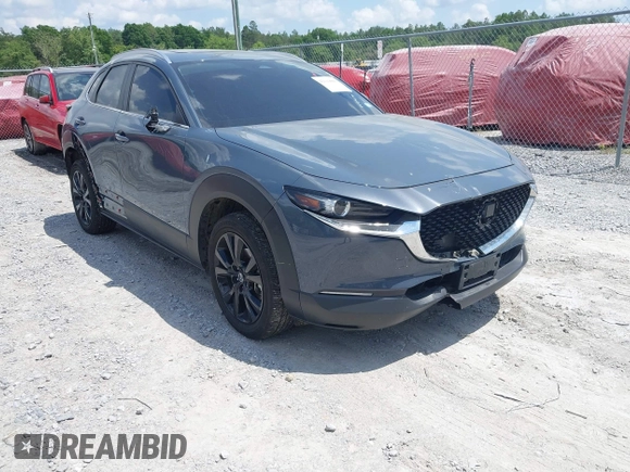 2024 Mazda CX-30 S Preferred with VIN 3MVDMBCM5RM648894, listed as a IAAI auction lot 42119860 with 23,857 mi miles and . Bid and sale history available at DreamBid. Image 1.