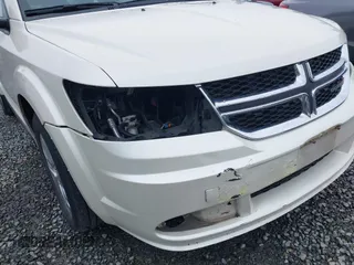 2015 Dodge Journey SE z VIN 3C4PDCAB6FT736330, wystawiony jako IAAI lot #41837047 z przebiegiem 123 567 mil mil oraz . Historia ofert i sprzedaży dostępna na DreamBid. Obrazek 6.