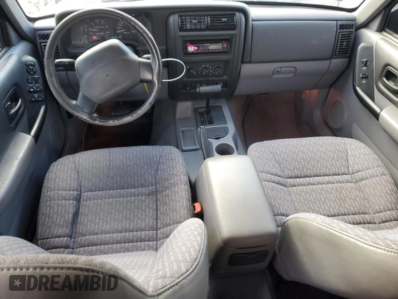 1998 Jeep Cherokee Sport with VIN 1J4FT68S2WL236774, listed as a Copart auction lot 77388734 with 128,591 mi miles and Clean Title. Bid and sale history available at carsss.com. Image 8.