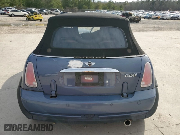 2005 MINI Convertible with VIN WMWRF33555TF62593, listed as a Copart auction lot 48305985 with 172,839 mi miles and Salvage title. Bid and sale history available at DreamBid. Image 6.