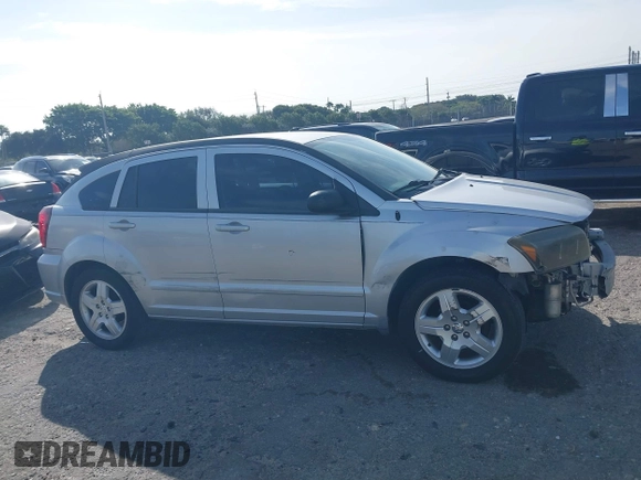 2009 Dodge Caliber SXT with VIN 1B3HB48A39D142674, listed as a IAAI auction lot 41642867 with 156,504 mi miles and . Bid and sale history available at carsss.com. Image 14.