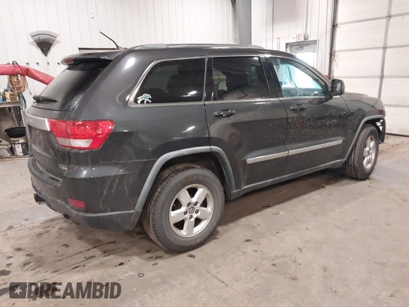 2011 Jeep Grand Cherokee 70th Anniversary with VIN 1J4RR4GG3BC745652, listed as a IAAI auction lot 41133698 with 217,948 mi miles. Bid and sale history available at carsss.com. Image 4.