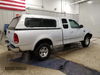 1999 Ford F-150 with VIN 1FTRX18W2XKB01444, listed as a Copart auction lot 52717195 with 210,581 mi miles and Clean title. Bid and sale history available at DreamBid. Image 3.