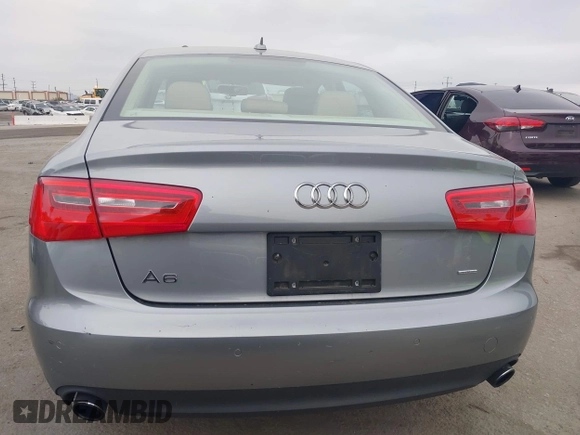 2015 Audi A6 Premium Plus z VIN WAUGFAFC6FN009203, wystawiony jako IAAI lot #42242726 z przebiegiem 69 163 mil mil oraz . Historia ofert i sprzedaży dostępna na DreamBid. Obrazek 16.