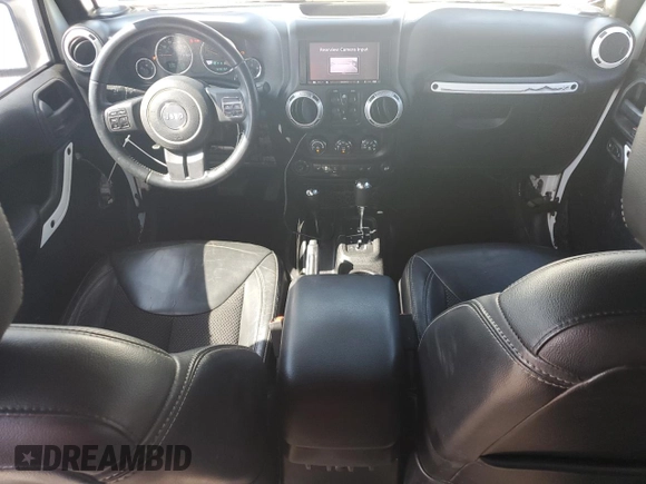 2015 Jeep Wrangler Unlimited Sahara with VIN 1C4BJWEG3FL584920, listed as a Copart auction lot 61843525 with 62,876 mi miles and Salvage title. Bid and sale history available at DreamBid. Image 8.