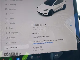 2021 Tesla Model Y Long Range with VIN 5YJYGDEE7MF224531, listed as a IAAI auction lot 38454442 with 52,408 mi miles. Bid and sale history available at carsss.com. Image 7.
