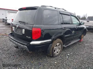2004 Honda Pilot EX with VIN 2HKYF18674H585328, listed as a IAAI auction lot 41688735 with 214,194 mi miles. Bid and sale history available at carsss.com. Image 4.