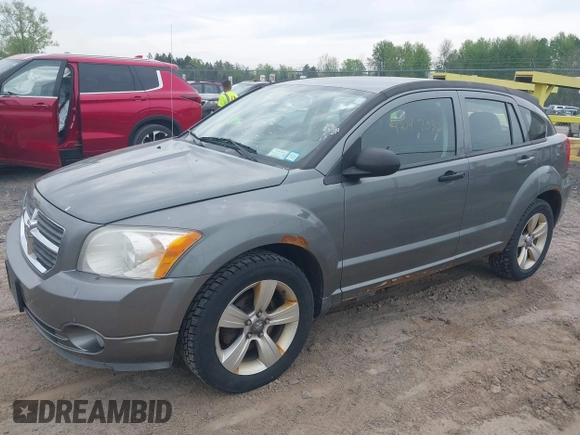 2012 Dodge Caliber SXT with VIN 1C3CDWDA5CD534457, listed as a IAAI auction lot 42197032 with 170,739 mi miles and . Bid and sale history available at DreamBid. Image 2.