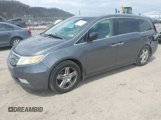 2012 Honda Odyssey Touring with VIN 5FNRL5H90CB045430, listed as a IAAI auction lot 42079770 with 113,901 mi miles and . Bid and sale history available at DreamBid. Image 18.