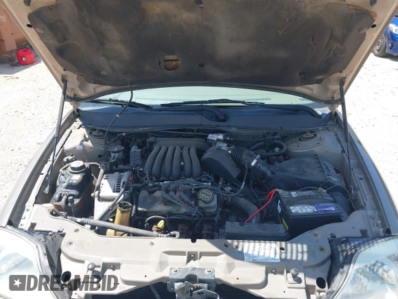 2003 Mercury Sable GS z VIN 1MEFM50U23A601955, wystawiony jako IAAI lot #42197171 z przebiegiem 94 977 mil mil oraz . Historia ofert i sprzedaży dostępna na DreamBid. Obrazek 10.