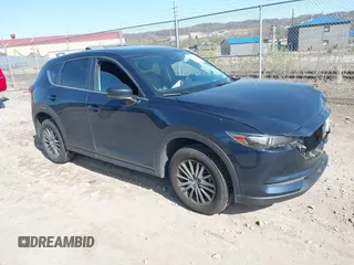 2019 Mazda CX-5 Touring with VIN JM3KFBCM8K0518806, listed as a IAAI auction lot 42038168 with 61,449 mi miles and . Bid and sale history available at carsss.com. Image 1.