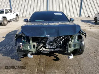 2023 Genesis G70 2.0T with VIN KMTG34TA5PU129955, listed as a Copart auction lot 82980774 with 12,625 mi miles and Salvage Title. Bid and sale history available at DreamBid. Image 5.