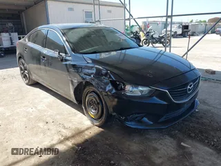 2015 Mazda 6 i Grand Touring with VIN JM1GJ1W59F1179548, listed as a IAAI auction lot 42004860 with 153,532 mi miles and . Bid and sale history available at DreamBid. Image 1.