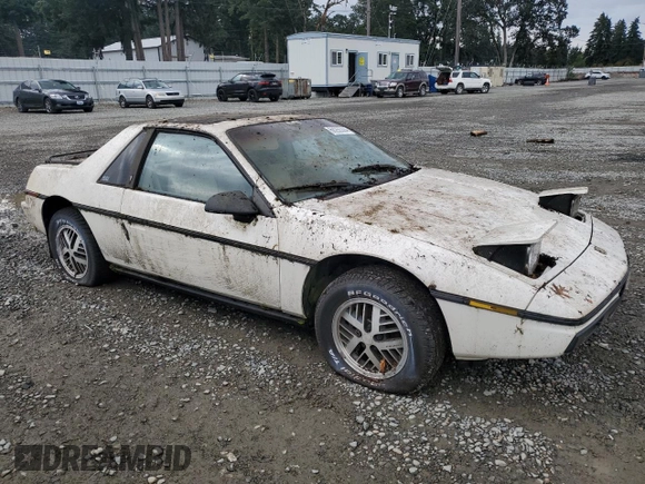 1984 Pontiac Fiero z VIN 1G2AF37R6EP320306, wystawiony jako Copart lot #68255394 z przebiegiem 49 284 mil mil oraz Czysty tytuł • Clean title. Historia ofert i sprzedaży dostępna na DreamBid. Obrazek 4.