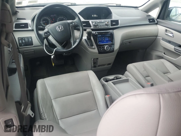 2014 Honda Odyssey EX-L with VIN 5FNRL5H63EB013483, listed as a Copart auction lot 63002435 with 127,059 mi miles and Salvage title. Bid and sale history available at DreamBid. Image 8.