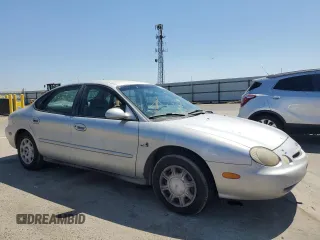 1997 Ford Taurus GL with VIN 1FALP5228VG222228, listed as a Copart auction lot 64806845 with 160,397 mi miles and Salvage title. Bid and sale history available at DreamBid. Image 4.