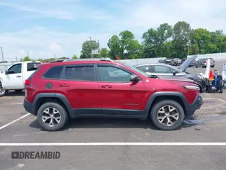 2014 Jeep Cherokee Trailhawk with VIN 1C4PJMBS7EW162357, listed as a IAAI auction lot 42601903 with 104,768 mi miles and . Bid and sale history available at DreamBid. Image 13.