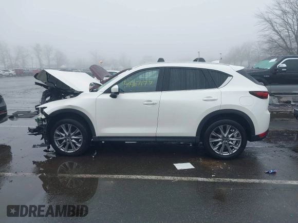 2020 Mazda CX-5 Grand Touring with VIN JM3KFBDMXL0785865, listed as a IAAI auction lot 41567177 with 64,519 mi miles. Bid and sale history available at carsss.com. Image 14.